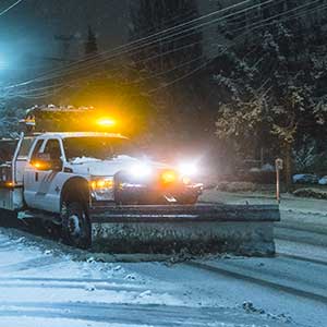 Snow plow fitted truck